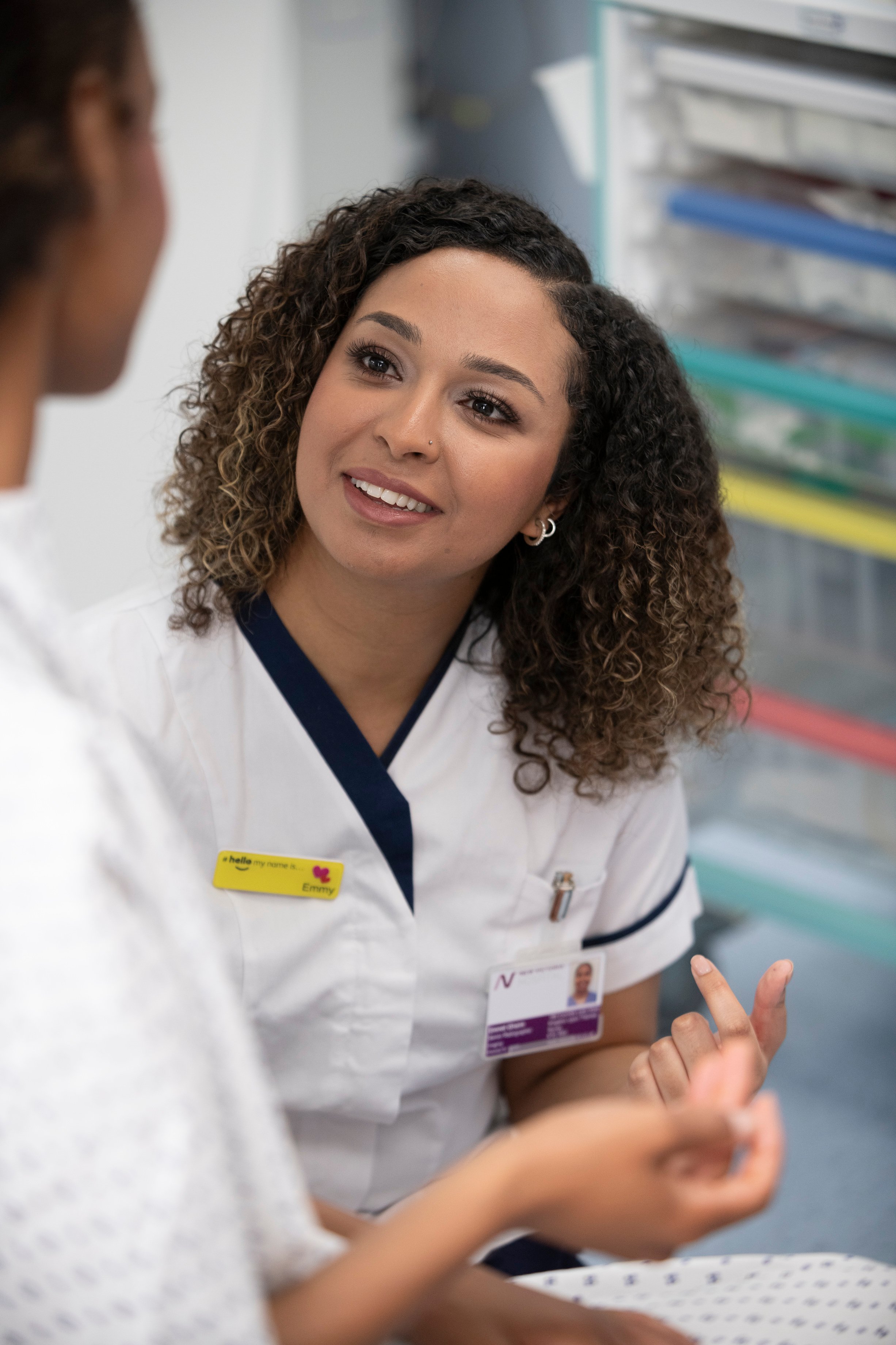women in imaging talking to a patient 