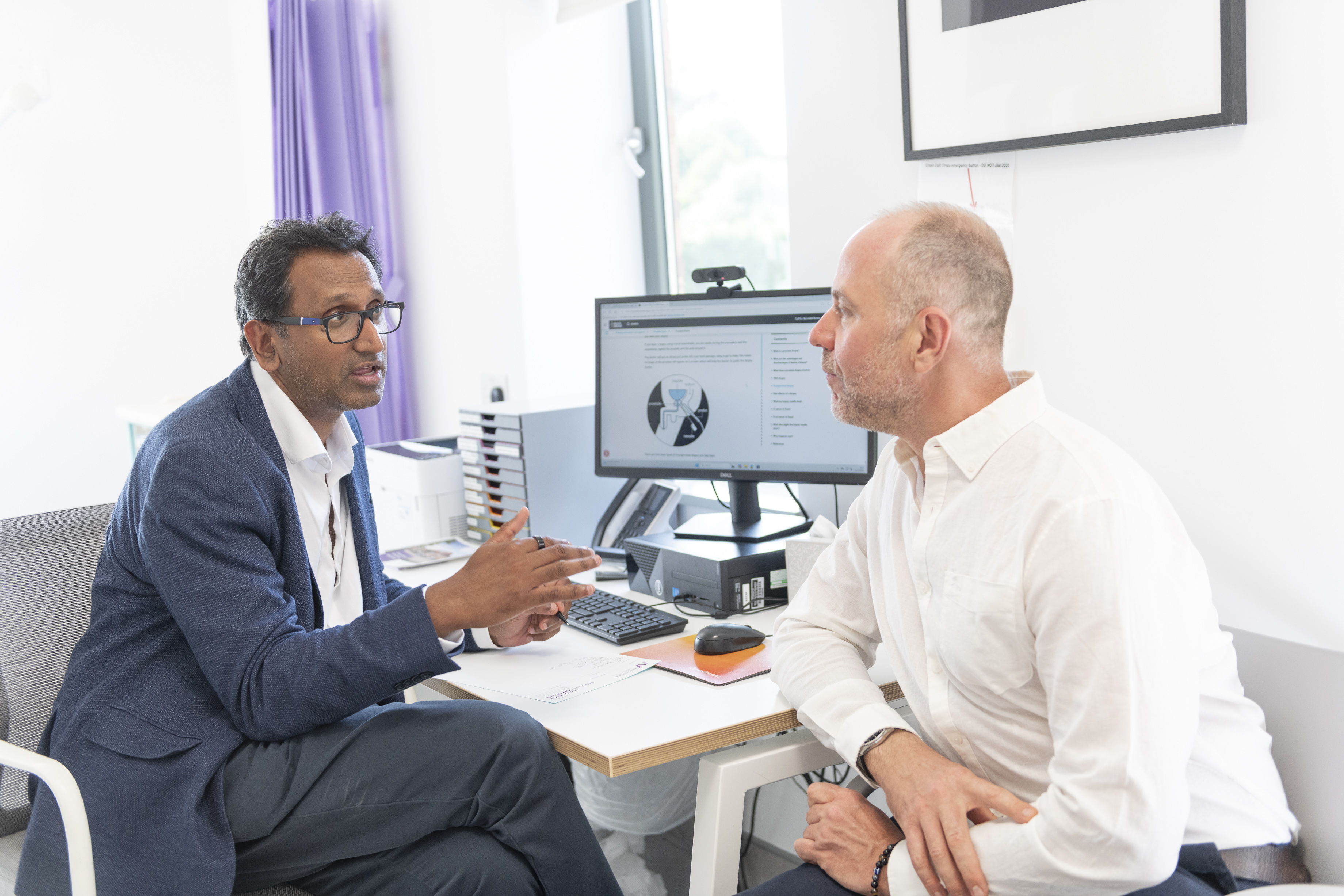 Urology Consultant talking to a patient