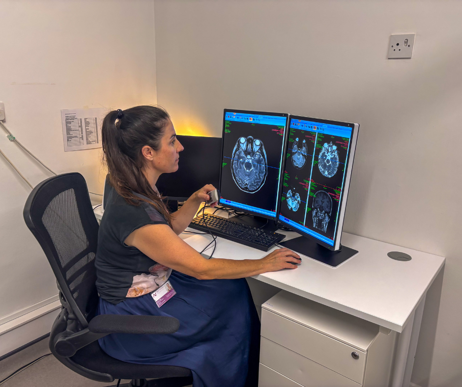 clinician looking at brain scans