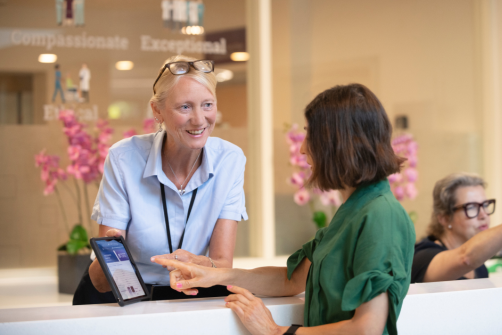 New Victoria Hospital receptionist talking to a patient