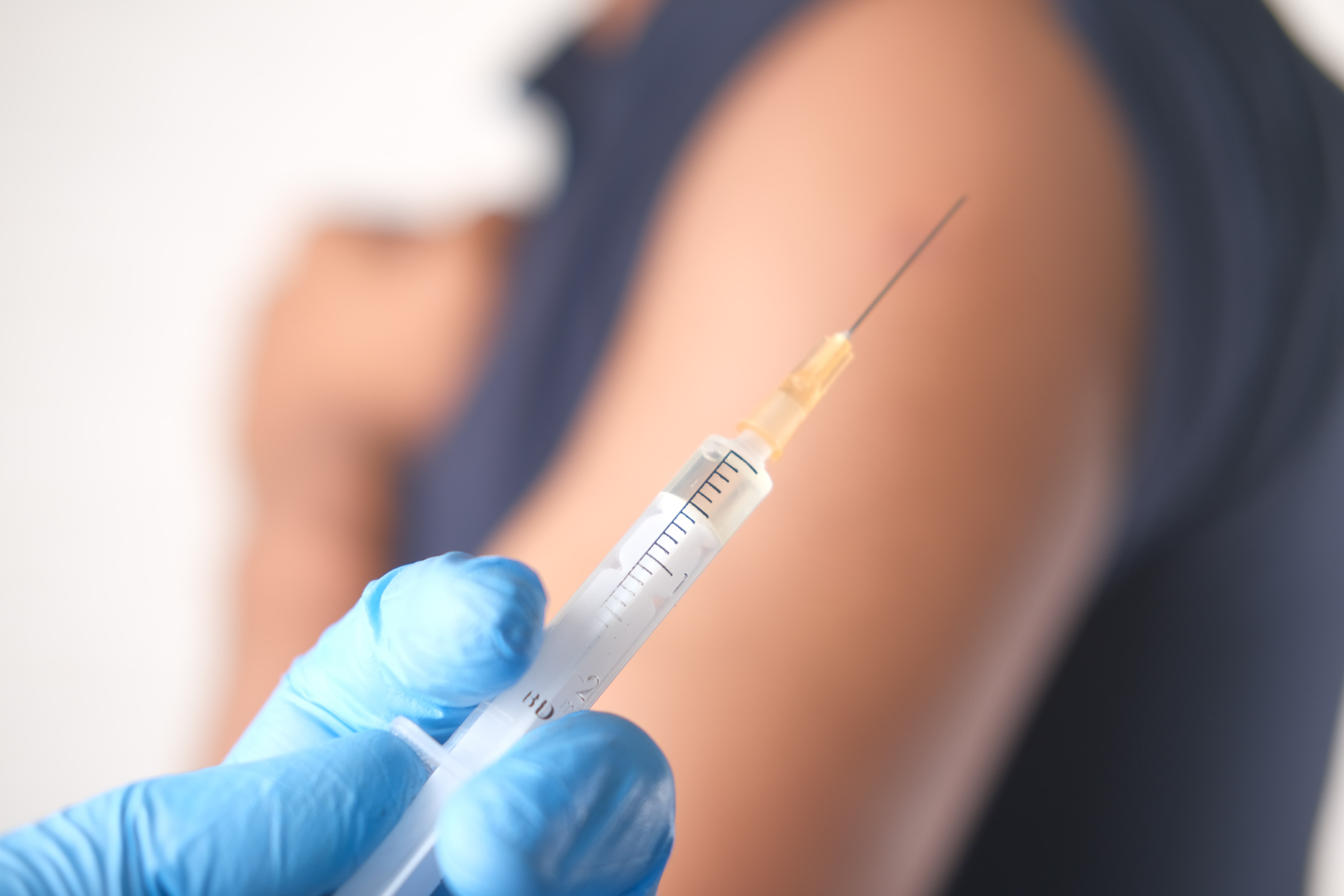 Needle being prepared for vaccination
